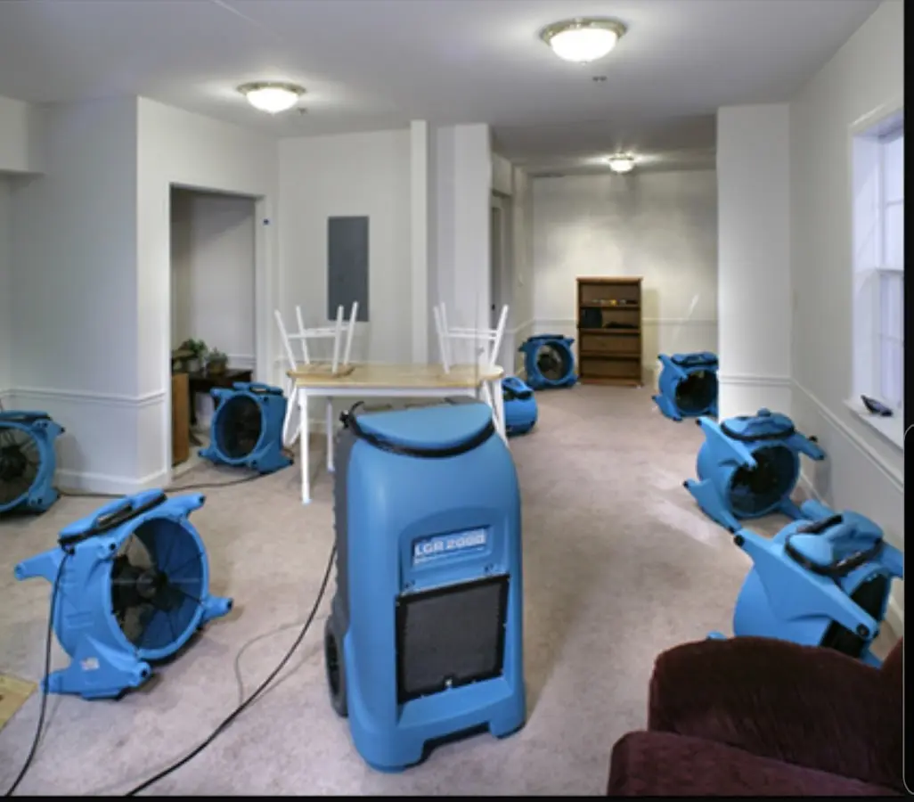 Air movers and dehumidifier setup for Water Damage Restoration in Lowell