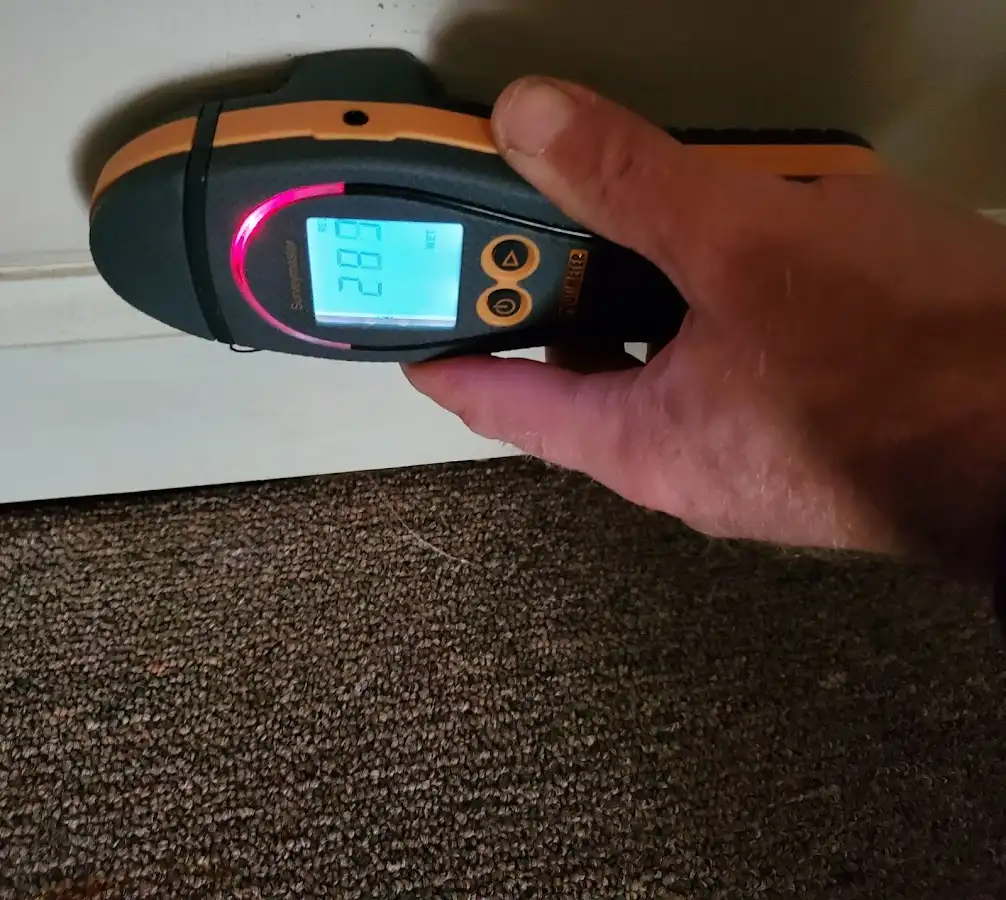 Moisture detection at baseboard during Burst Pipe Cleanup in Lowell